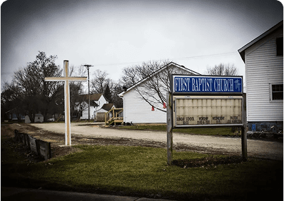 Rural church with empty signboard