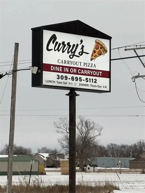 Roadside Curry's Carryout Pizza sign